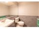 Simple bathroom featuring a white toilet, sink, and grey painted walls at 9400 E Iliff Ave # 411, Denver, CO 80231