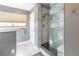 Bathroom with a glass shower stall, towel rack, blinds, and marble tile flooring at 9400 E Iliff Ave # 411, Denver, CO 80231