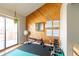 Home gym features wood paneled walls, exercise equipment, and dumbbell workout guides for easy reference at 9400 E Iliff Ave # 411, Denver, CO 80231
