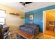 A cozy living room with comfortable seating, hardwood floors, and a blue accent wall at 9400 E Iliff Ave # 411, Denver, CO 80231