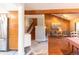 Bright living room with hardwood floors, wood paneled accent wall, and a fireplace at 9400 E Iliff Ave # 411, Denver, CO 80231