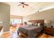 Spacious main bedroom with hardwood floors, a vaulted ceiling, and a large window at 9400 E Iliff Ave # 411, Denver, CO 80231