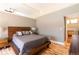 Large main bedroom features hardwood floors, a vaulted ceiling, and neutral paint colors at 9400 E Iliff Ave # 411, Denver, CO 80231