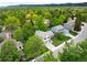 Aerial view of tree-lined neighborhood streets showcasing well-maintained homes and lush greenery at 9502 W Hialeah Pl, Littleton, CO 80123