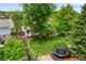 Aerial view of a beautiful landscaped backyard featuring a playground and trampoline at 9502 W Hialeah Pl, Littleton, CO 80123
