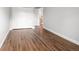 Empty bedroom featuring a closet, neutral paint, and wood floors at 9502 W Hialeah Pl, Littleton, CO 80123