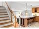 Spacious kitchen with breakfast bar, perfect for casual dining and entertaining, with hardwood floors at 9502 W Hialeah Pl, Littleton, CO 80123