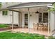 Cozy covered patio with string lights, an outdoor fan, and outdoor seating perfect for relaxing and entertaining at 9502 W Hialeah Pl, Littleton, CO 80123
