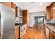 Bright kitchen with stainless steel appliances and wood flooring at 8550 E Davies Pl, Centennial, CO 80112