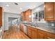 Kitchen with wood cabinets, granite countertops and stainless steel appliances at 8550 E Davies Pl, Centennial, CO 80112