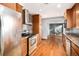 Kitchen with wood cabinets, granite countertops and stainless steel appliances at 8550 E Davies Pl, Centennial, CO 80112