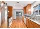 Kitchen with wood cabinets, granite countertops and stainless steel appliances at 8550 E Davies Pl, Centennial, CO 80112