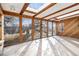 Bright sunroom with skylights and views of the backyard at 8550 E Davies Pl, Centennial, CO 80112