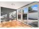 Sunroom with hardwood floors and sliding glass doors at 8550 E Davies Pl, Centennial, CO 80112