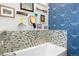 Eclectic bathroom design showcasing patterned wallpaper, colorful mosaics and a clawfoot bathtub at 12927 Woodridge Dr, Longmont, CO 80504