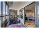 Balcony with a Peloton bike and a cozy seating area connecting to the bedroom and living room at 800 N Pearl St # 1207, Denver, CO 80203