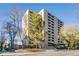 Exterior of building with balconies and mature trees enhancing the surrounding landscape at 800 N Pearl St # 1207, Denver, CO 80203