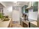 Well-appointed kitchen with tile backsplash, modern appliances and spacious countertops at 800 N Pearl St # 1207, Denver, CO 80203