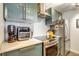 Sleek kitchen features stainless steel appliances, modern cabinetry and ample counter space at 800 N Pearl St # 1207, Denver, CO 80203