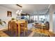 Open-concept living area offers comfortable seating and dining table, plus views to the balcony at 800 N Pearl St # 1207, Denver, CO 80203