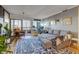 Cozy living room features a comfortable sectional sofa, balcony access and cityscape views at 800 N Pearl St # 1207, Denver, CO 80203