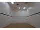 Empty racquetball court with white walls, black line, and standard court markings at 800 N Pearl St # 1207, Denver, CO 80203