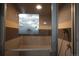 Relaxing steam room with warning sign, tiled walls, glass door, and shower fixture at 800 N Pearl St # 1207, Denver, CO 80203