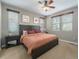 Comfortable bedroom with neutral walls, ceiling fan, and a large bed with side tables at 24028 E Caleb Pl, Aurora, CO 80016