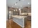 Kitchen featuring a center island, stainless steel appliances, and hardwood floors at 24028 E Caleb Pl, Aurora, CO 80016