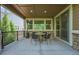 Covered patio with four chairs and a table perfect for entertaining at 24028 E Caleb Pl, Aurora, CO 80016