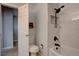 Bathroom featuring a toilet, modern black shower fixtures, and stylish tile at 8354 S Everett Way # C, Littleton, CO 80128