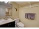 Bathroom with designer fixtures, decorative backsplash and a mirror with storage inside at 8354 S Everett Way # C, Littleton, CO 80128