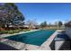 Covered community pool providing a refreshing escape, surrounded by trees and landscaping at 8354 S Everett Way # C, Littleton, CO 80128