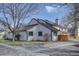 Exterior view of a townhome with an attached garage and well-maintained lawn at 8354 S Everett Way # C, Littleton, CO 80128