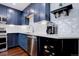 Modern kitchen with stainless steel appliances, ample counter space, and a wine cooler at 8354 S Everett Way # C, Littleton, CO 80128