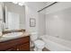 Bathroom featuring a vanity with a sink, toilet, and bathtub with shower at 13020 Grant W Cir # A, Thornton, CO 80241