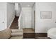 Bright entryway with staircase, wood floors, and an adjacent living space at 13020 Grant W Cir # A, Thornton, CO 80241