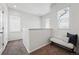 Bright hallway featuring a cushioned bench with dark pillow and carpeted floors at 13020 Grant W Cir # A, Thornton, CO 80241