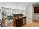 Cozy kitchen view into the dining area, complete with stainless steel dishwasher at 13020 Grant W Cir # A, Thornton, CO 80241