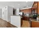 Modern kitchen featuring granite countertops, stainless steel appliances, and ample cabinet space at 13020 Grant W Cir # A, Thornton, CO 80241
