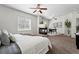 Expansive main bedroom boasts a fireplace and a ceiling fan at 13020 Grant W Cir # A, Thornton, CO 80241
