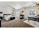 Spacious main bedroom features a unique fireplace, dual ceiling fans and carpeted flooring at 13020 Grant W Cir # A, Thornton, CO 80241