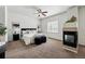 Cozy main bedroom with accent fireplace, lamps, and a soft rug at 13020 Grant W Cir # A, Thornton, CO 80241