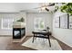 Office space featuring a fireplace, desk and ceiling fan at 13020 Grant W Cir # A, Thornton, CO 80241