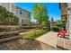 Cozy patio area with a wooden fence and landscaped surroundings at 13020 Grant W Cir # A, Thornton, CO 80241