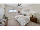 Serene bedroom with a large window, soft carpet, and stylish decor at 1473 N Locust St, Denver, CO 80220