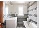 Updated bathroom with subway tile and clawfoot tub at 2250 N Hooker St, Denver, CO 80211