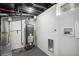 This basement has a water heater and is prepped for a washer and dryer at 530 Everett St, Lakewood, CO 80226