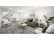 Finished basement with seating area featuring gray sofa, gray carpet, and modern decor at 530 Everett St, Lakewood, CO 80226