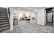 Spacious finished basement with gray carpet, recessed lighting, and modern furnishings at 530 Everett St, Lakewood, CO 80226